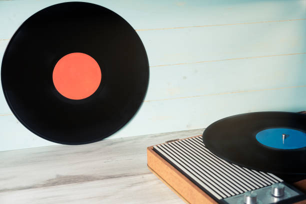 istock Vinyl record and vintage record player 1290124130