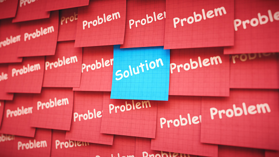Many sticky notes with the words 'problem' and 'solution' written on them