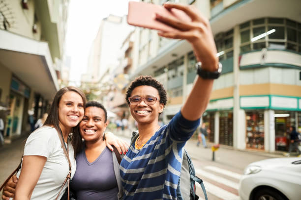 istock Female tourists taking selfies 1290126623