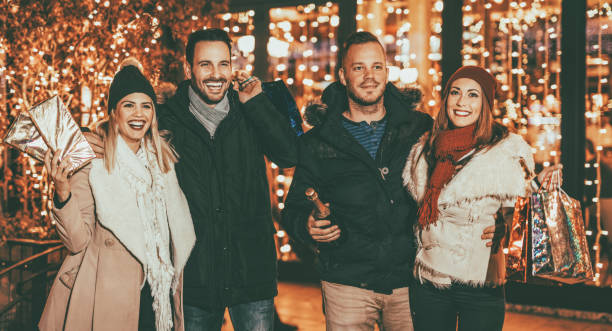 istock Young Friends Enjoying Shopping 1290127938