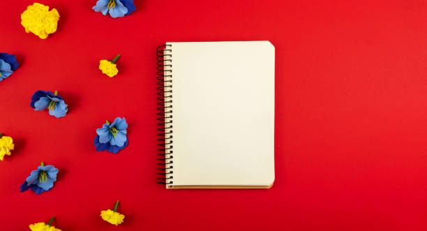 istock Flowers composition, blank notepad on a red background, place for text, copy space, banner 1290129896