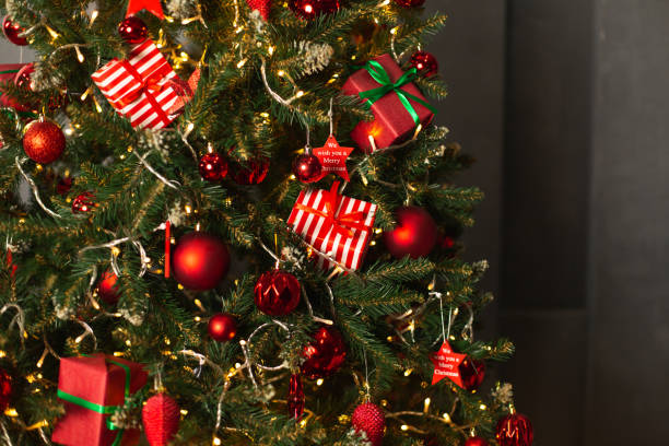 istock Christmas tree with traditional baubles and fairy lights 1290131548
