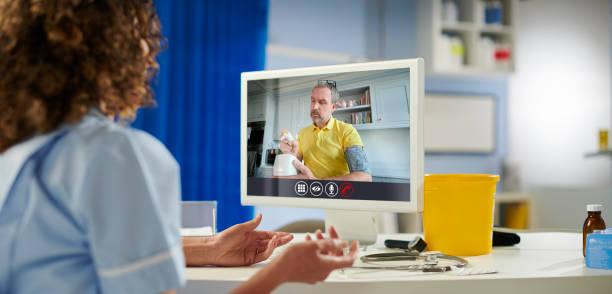 telemedicine patient gp talking to patient on a video call triage stock pictures, royalty-free photos & images