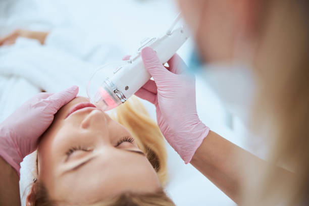 istock Doctor using hardware cosmetology for treating her patient 1290133492