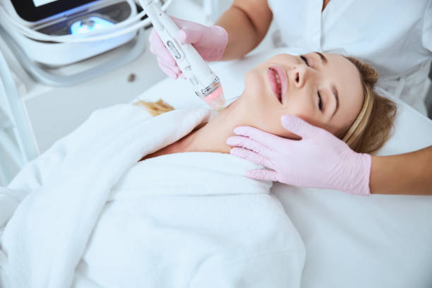 istock Woman being treated for fine lines on her neck 1290133532