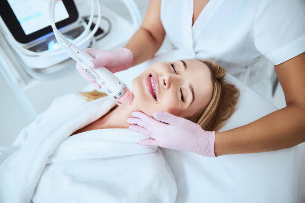 istock Happy spa patient enjoying the cosmetic procedure 1290133534