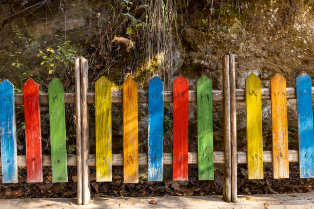 Wooden background from boards of a different color. Visible structure of the tree and the gap.