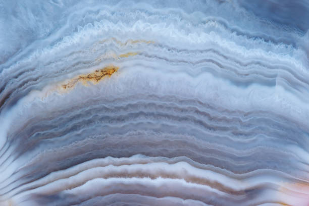 istock Full-screen close-up texture of light blue layered agate with ghostly quartz crystals and brown iron oxide dendrites 1290136220