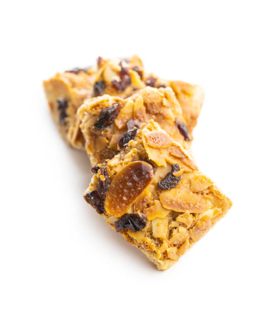 istock Crunchy cereal cookies with nuts and raisins isolated 1290136859