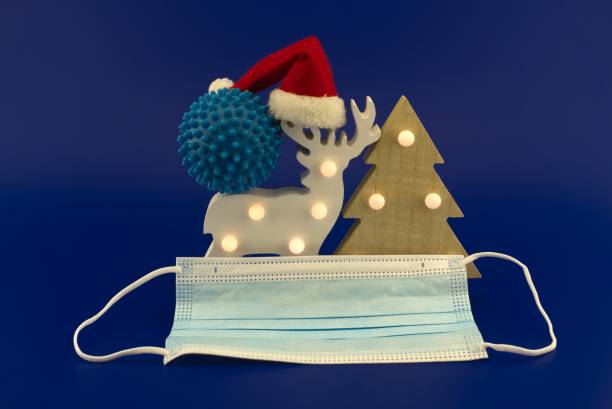 istock Christmas in pandemic concept with virus molecule 1290146998