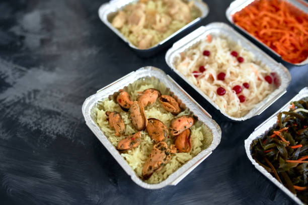 istock Different foil containers with delicious food. 1290151204