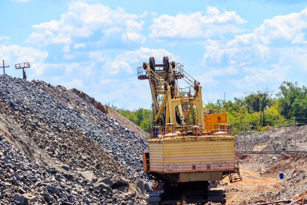 istock Big excavator working in iron ore quarry. Mining industry 1290151635