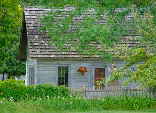 istock Rustic country home with trees in the summer 1290154036