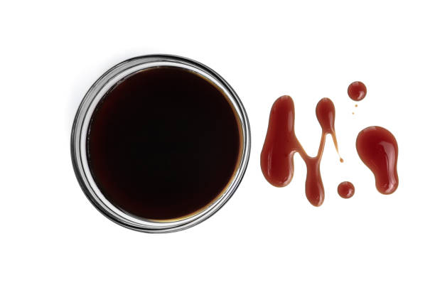 istock red ketchup splashes in bowl isolated on white background, tomato pure texture, top view 1290154078
