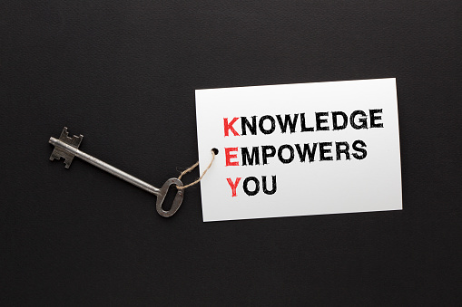 Knowledge Empowers You (KEY) message with key.