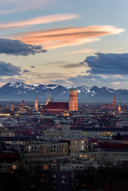 Beautiful illuminated Munich city skyline with Alps in background Beautiful illuminated Munich city skyline with Alps in background munich stock pictures, royalty-free photos & images