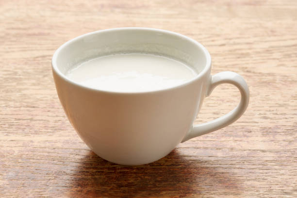 Vanilla shake in a glass on the table