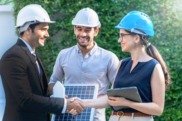 istock Business Engineers Meeting Innovative More Efficient Solar Panel Battery Concept of Renewable Energy Working. Specialists Gathered for Outdoor testing Photovoltaic cells module. 1290161756