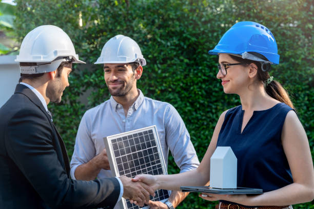istock Business Engineers Meeting Innovative More Efficient Solar Panel Battery Concept of Renewable Energy Working. Specialists Gathered for Outdoor testing Photovoltaic cells module. 1290161827