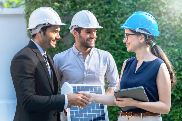 istock Business Engineers Meeting Innovative More Efficient Solar Panel Battery Concept of Renewable Energy Working. Specialists Gathered for Outdoor testing Photovoltaic cells module. 1290161925