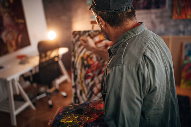 istock One senior painter painting late into the night in his studio 1290162222