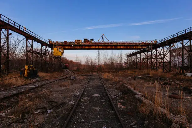 Old rusty overhead crane at abandoned industrial area.