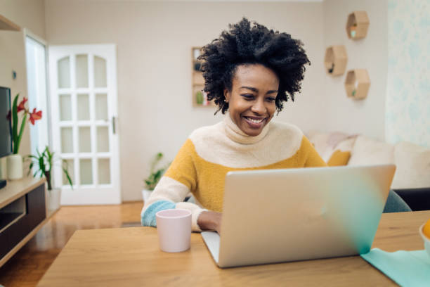 istock Young African-American woman working online 1290165885