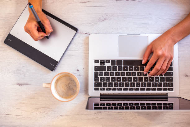 istock Top view of graphic designer workspace with coffee 1290166963