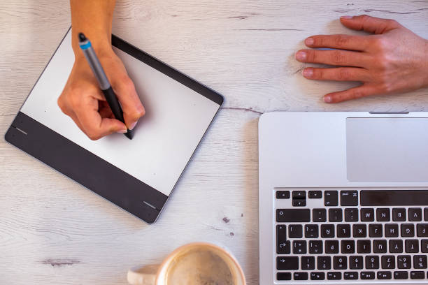 istock Top view of graphic designer workspace with coffee 1290166971