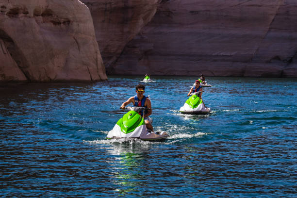 Jet skiing at Lake Powell Lone Rock at Sunset Utah USA. Page, USA - September 21, 2018.