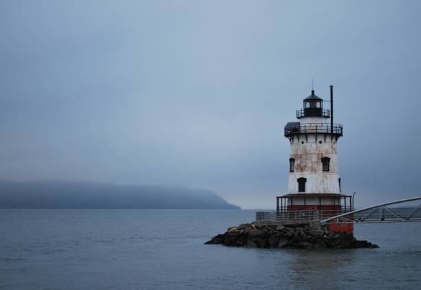 istock Sleepy Hollow Lighthouse on a Foggy Day 1290171630