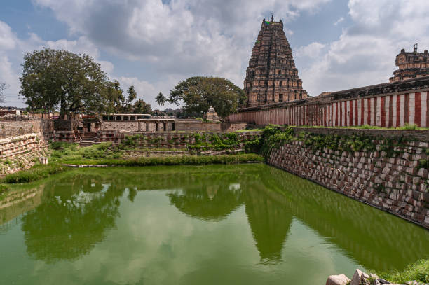 istock Mamatha Tank reflection outside Virupaksha temple, Hampi, Karnataka, India. 1290171744