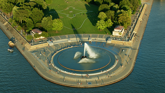 Aerial shot of a large fountain in Pittsburgh, Pennsylvania late on a summer afternoon.
