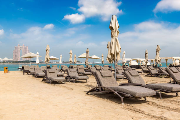 istock Sunbeds at the beach in Abu Dhabi 1290175620