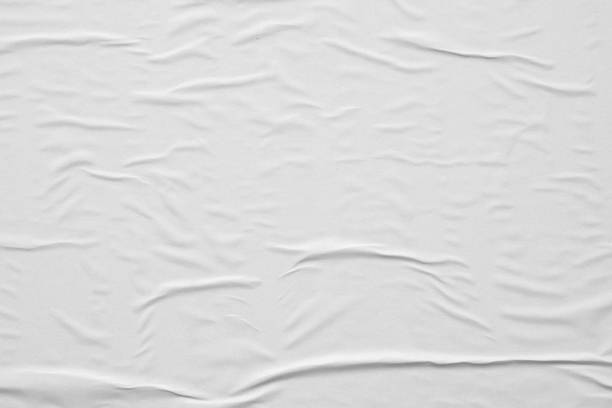istock Blank white crumpled and creased paper poster texture background 1290179136