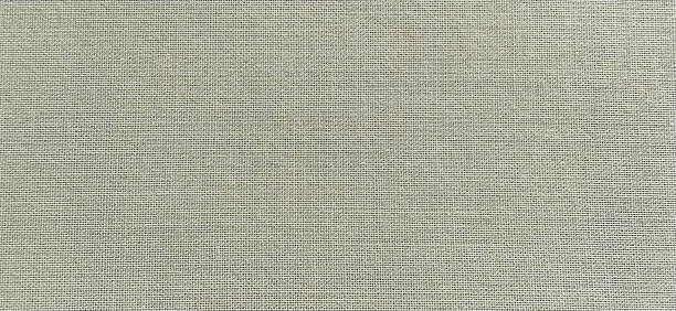 istock gray background of intertwined threads and rows. Banner. Fabric texture with uneven surface 1290179225