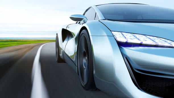 istock gray sportscar driving on a road 1290187853