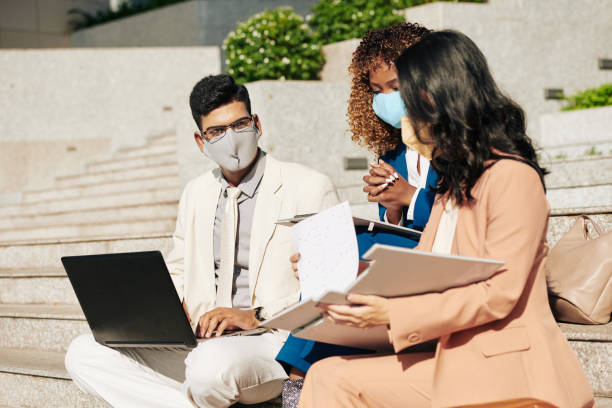 istock Entrepreneurs having meeting outdoors 1290189161
