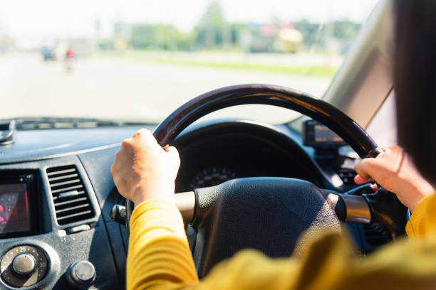 istock woman while driving the car 1290189227