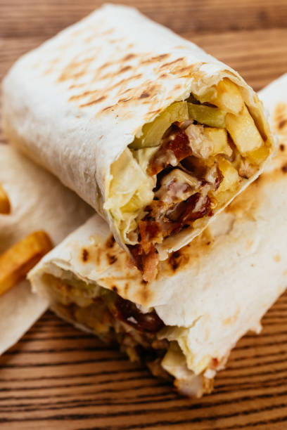 istock Turkish Shawarma on a wooden Board and light background 1290189971