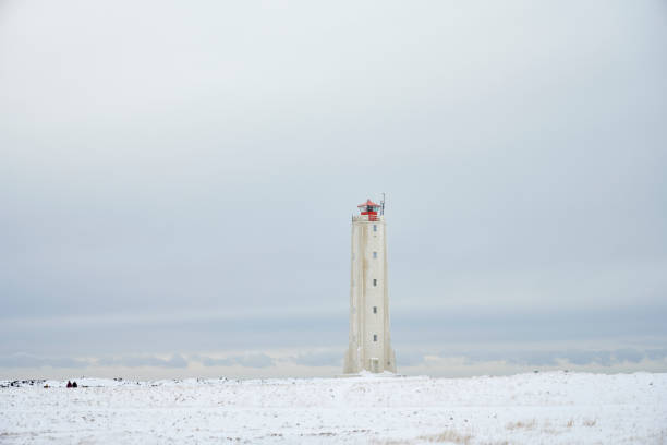 Lighthouse against cloudy sky in winter in Snæfellsbær, Iceland