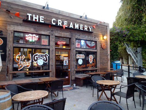 San Francisco - October 16, 2010: The Creamery Coffee Shop with Giants Baseball sign on windows.  The Creamery is a Local hub offering a menu of crÃªpes, salads & sandwiches & a weekly open-mike night.