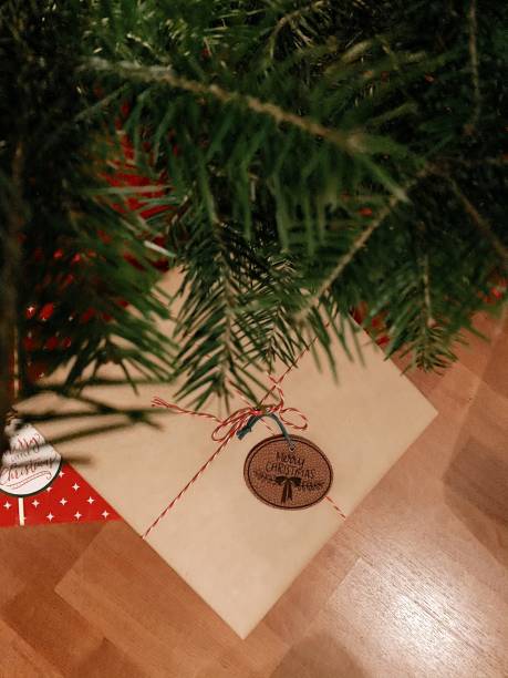 istock Red & Brown Christmas Presents Wrapped Up Under the Christmas Tree With Gift Tags That Say 