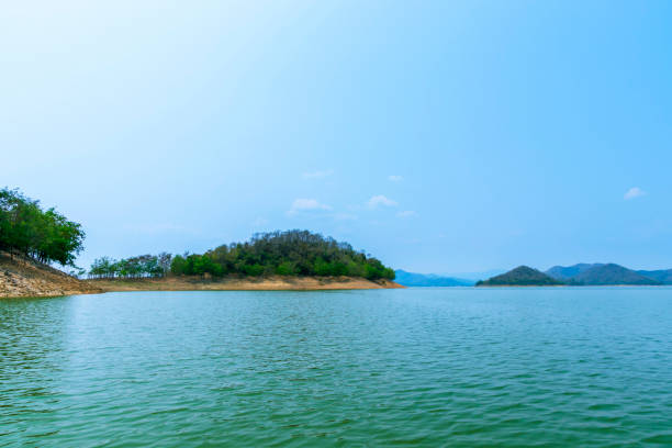 istock The lake scenery with mountains behind under the blue sky 1290198498