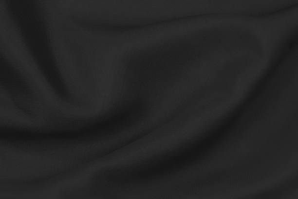 istock Smooth elegant black silk fabric or satin luxury cloth texture can use as wedding background. for drapery luxurious abstract design 1290198556