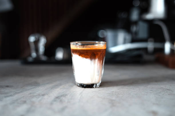 istock Milk coffee,Milk and coffee in a glass from the maker 1290199522