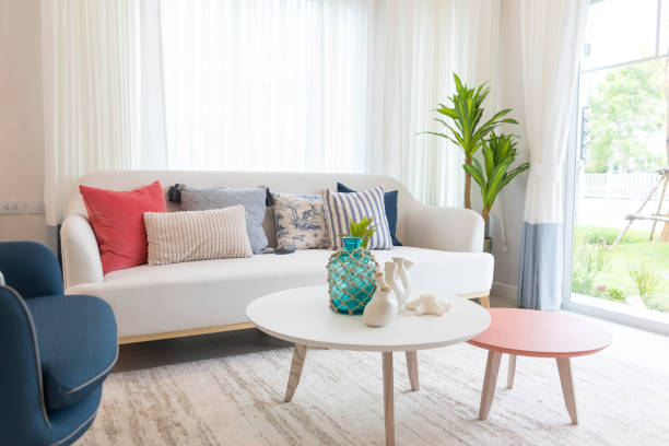 istock White, blue and red pillows on white sofa in living room. 1290199690