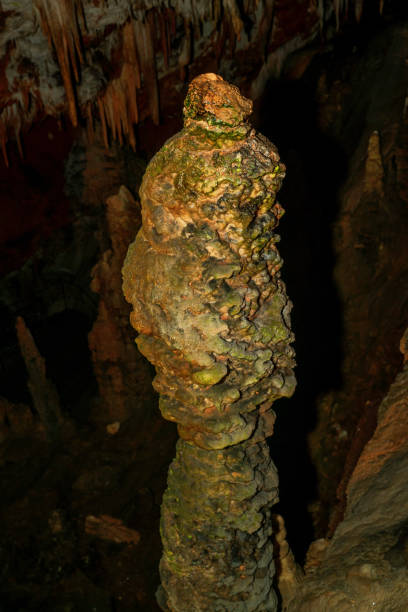 istock Detail of cave wall, stalactites and stalagmites. 1290200411