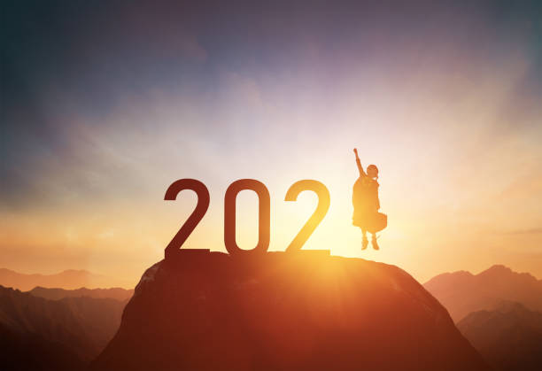 istock child standing on the mountain with 2021 1290200948