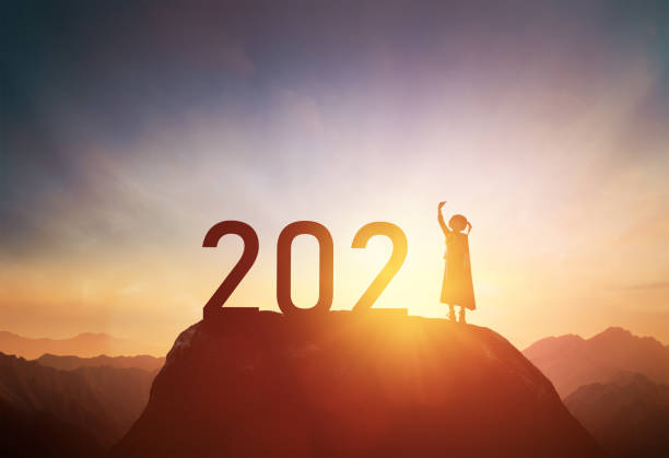 istock child standing on the mountain with 2021 1290200971
